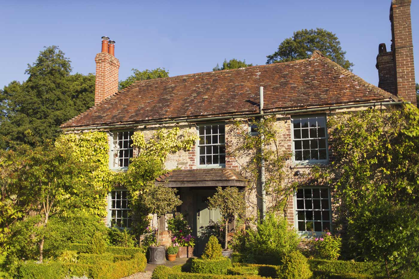 Ivy covered cottage with well kept garden